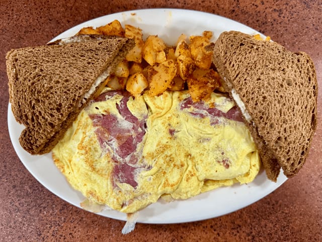 Sliced Corned Beef & Swiss Omelet.
